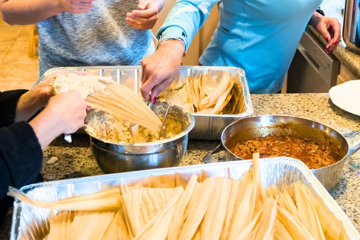 Woman making Tamales in a Domestic Kitchen.