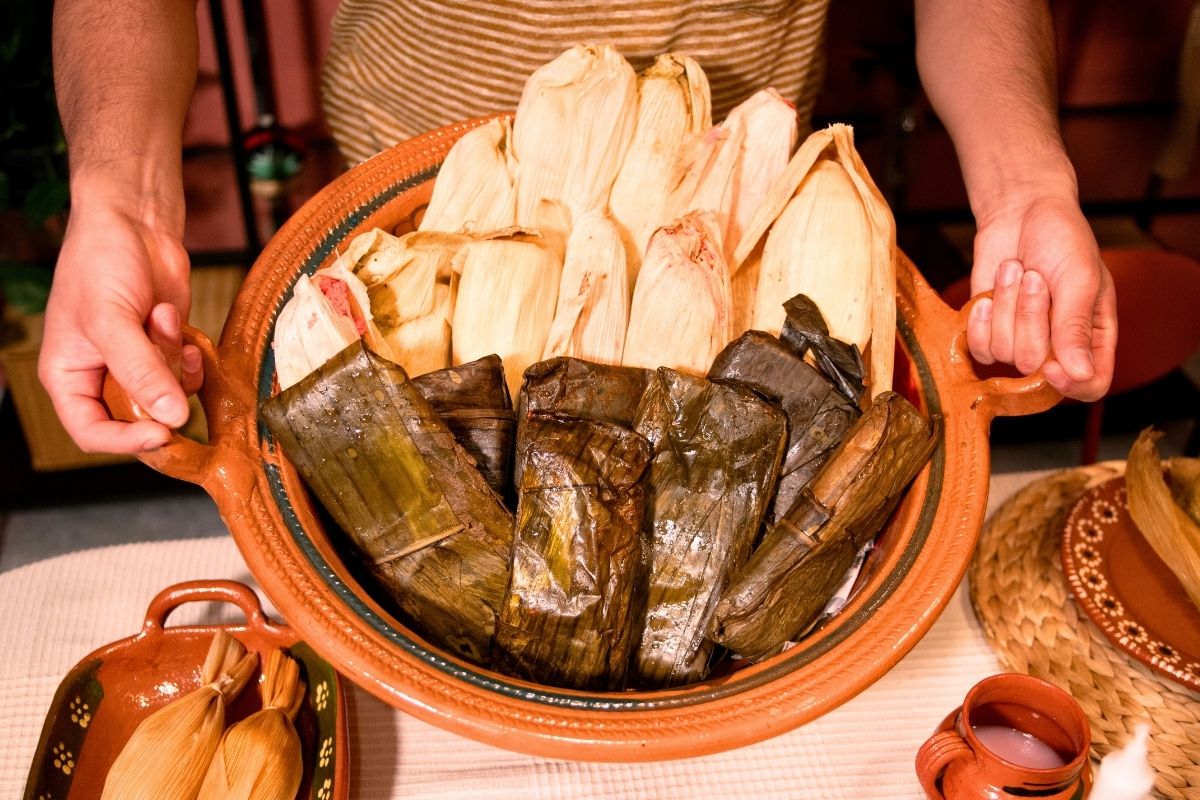 A photo of Tamales in a brown Basket.