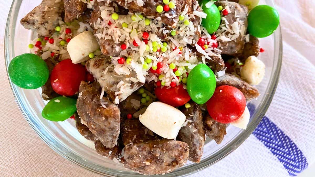 A glass bowl of Christmas puppy chow.