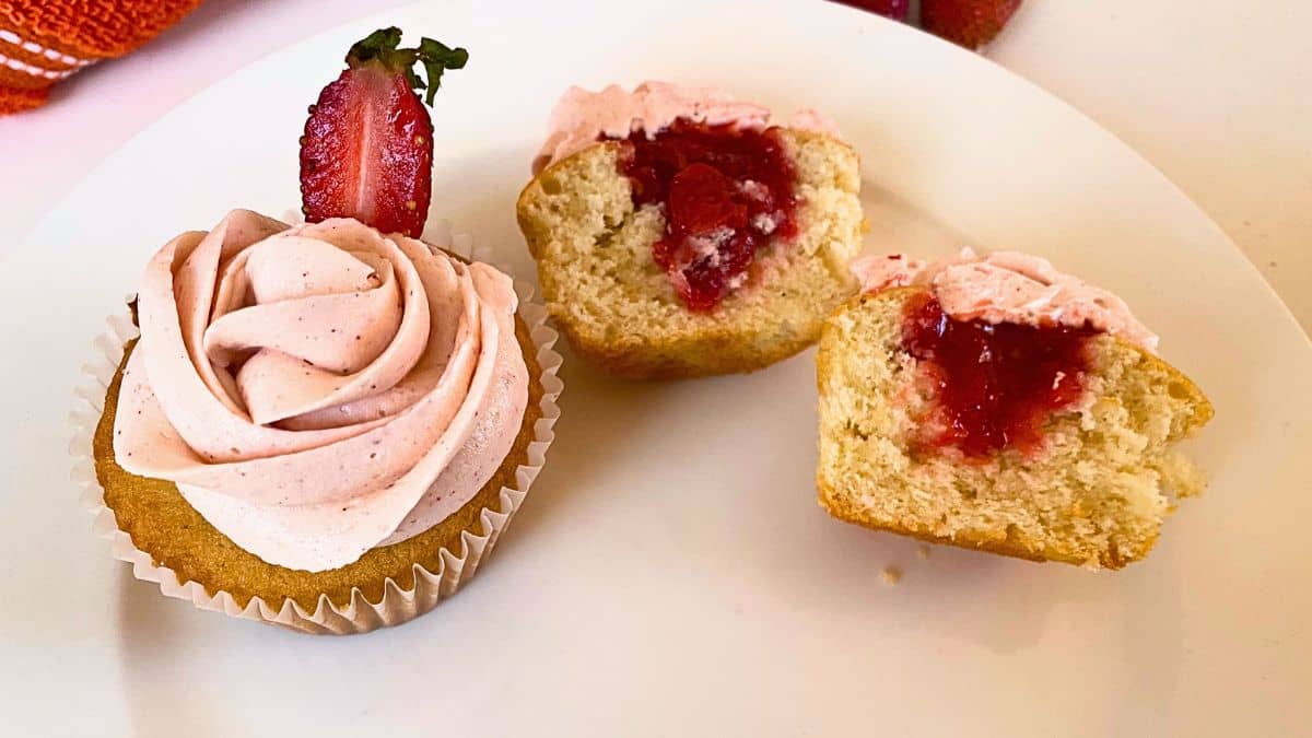 Strawberry Cupcakes with strawberry Filling on a white plate.