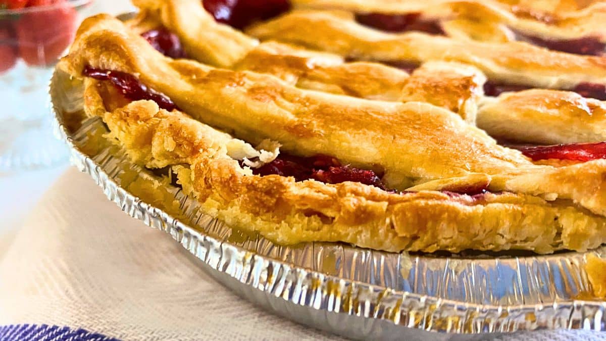 A close up of a pie in a tin pan.