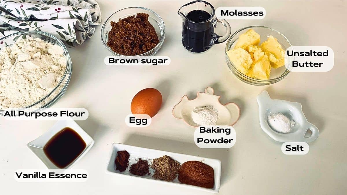 A group of ginger bread ingredients in bowls and cups.