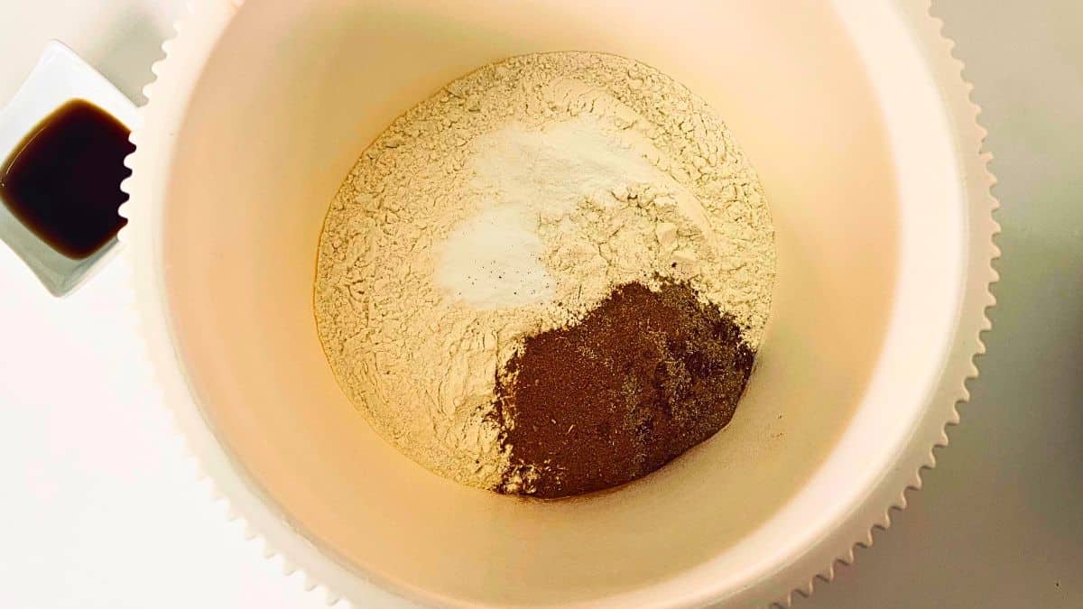 Dry flour ingredients in a white mixing bowl.