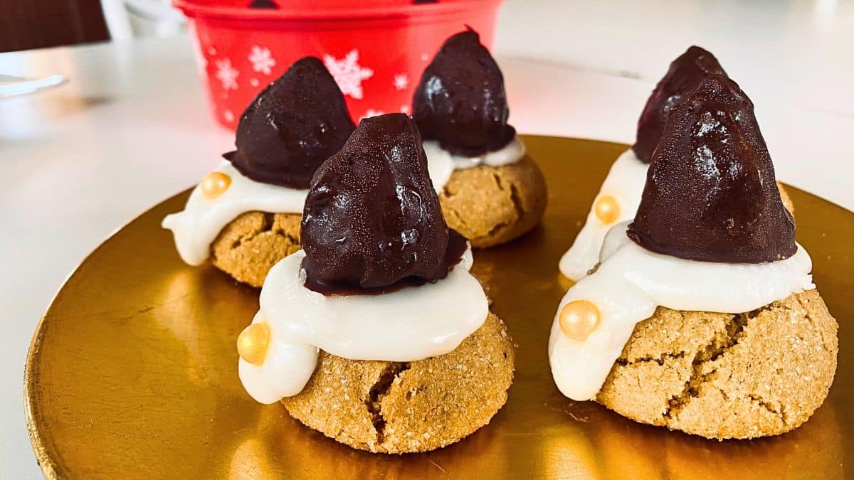 Peanut Butter Blossom Gnome Cookies on a golden tray.