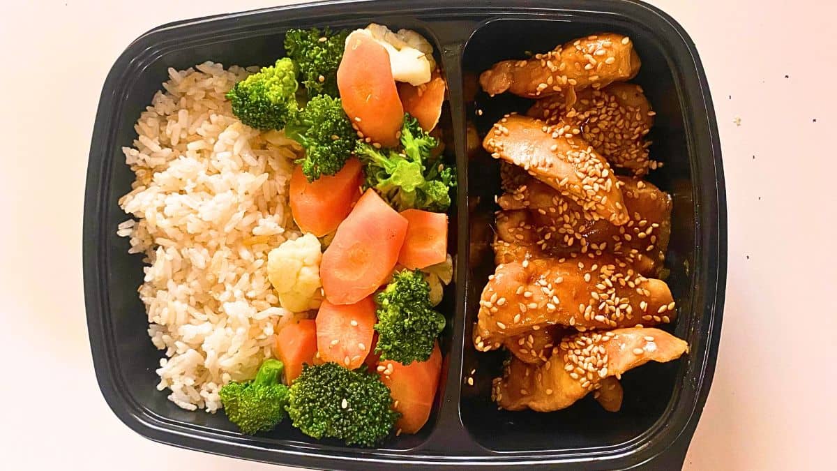 Teriyaki Chicken and Broccoli meal prep meal on a white surface.