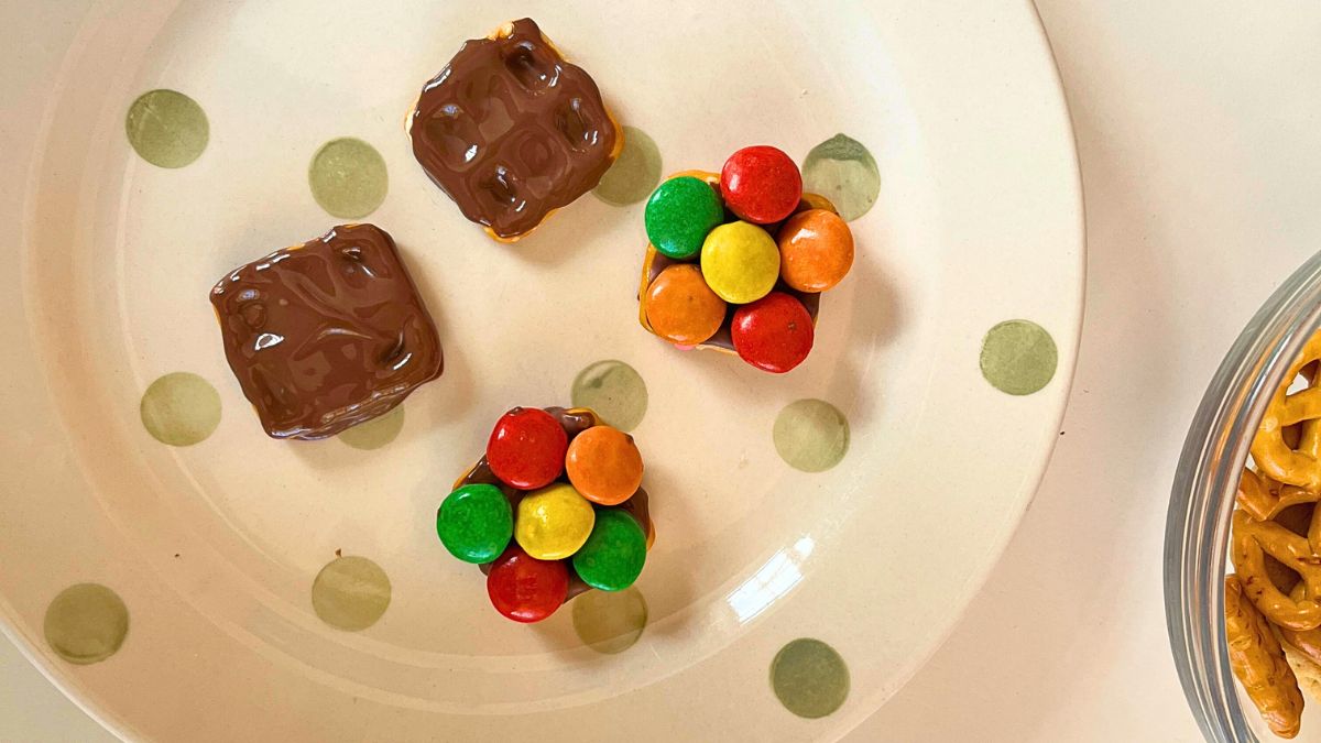 Easter Chocolate With M and M Flower treats on a white plate.