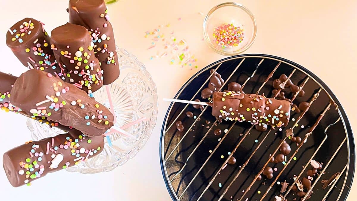 Chocolate covered pops with sprinkles and chocolate.