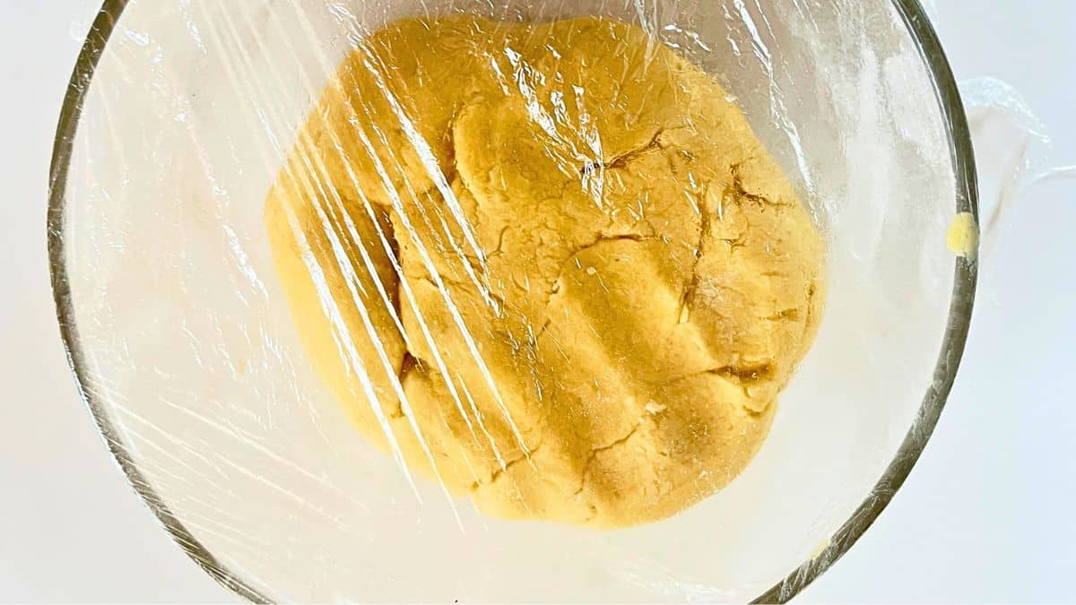 A dough in a plastic wrap.